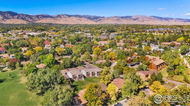 aerial view of residential area featuring a mountainous background