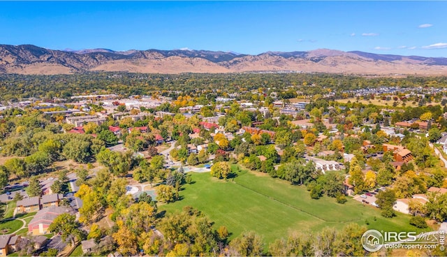 aerial view of residential area featuring a mountainous background