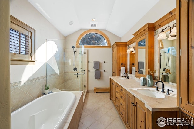 229 Albion St, Denver, CO 80220 - bathroom featuring lofted ceiling, tiled shower, double vanity, a garden tub, and tile patterned flooring