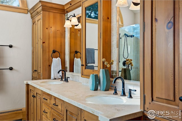 229 Albion St, Denver, CO 80220 - full bathroom featuring double vanity, a baseboard heating unit, and a tile shower
