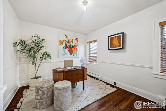 229 Albion St, Denver, CO 80220 - home office featuring wood finished floors, plenty of natural light, baseboards, and a baseboard radiator