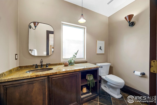 229 Albion St, Denver, CO 80220 - bathroom with vanity and toilet