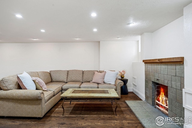 229 Albion St, Denver, CO 80220 - living room featuring dark wood-style floors, a fireplace, recessed lighting, and baseboards