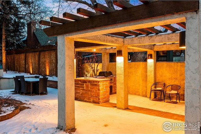 229 Albion St, Denver, CO 80220 - snow covered patio featuring area for grilling, a patio area, and a pergola