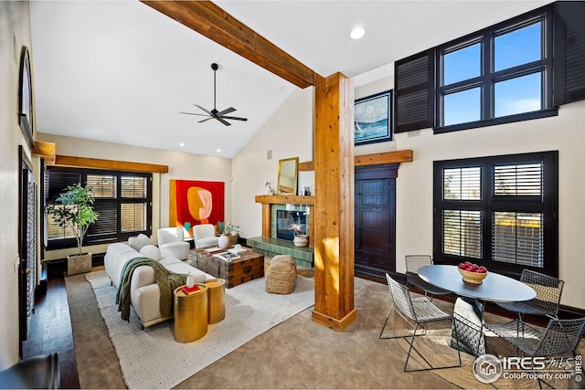 229 Albion St, Denver, CO 80220 - living room featuring high vaulted ceiling, ceiling fan, beamed ceiling, a fireplace, and carpet floors