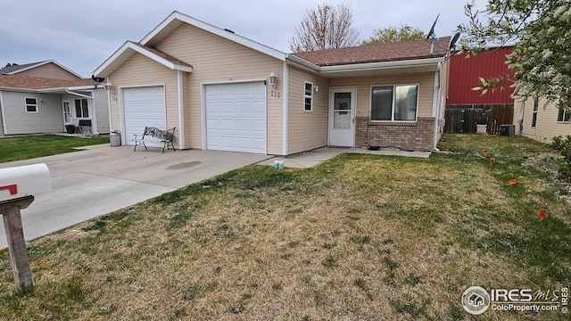 single story home featuring an attached garage, driveway, brick siding, and central AC unit