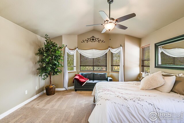 1108 Basin Ct, Windsor, CO 80550 - carpeted bedroom featuring multiple windows, baseboards, lofted ceiling, and a ceiling fan