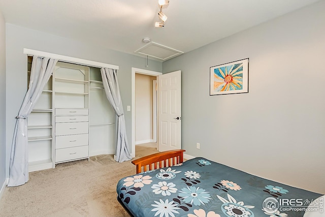 1108 Basin Ct, Windsor, CO 80550 - bedroom featuring light colored carpet, attic access, a closet, and baseboards