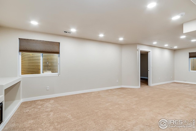 1108 Basin Ct, Windsor, CO 80550 - spare room featuring light carpet, recessed lighting, and baseboards