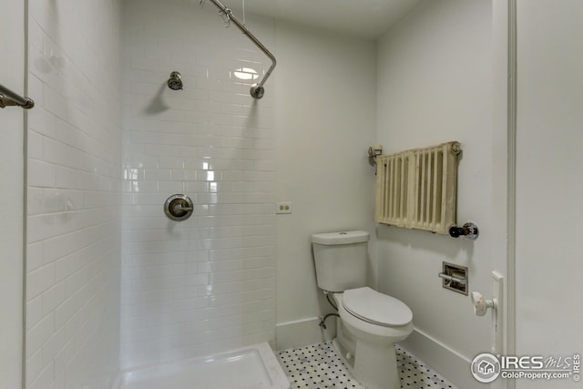 1110 13th St, Boulder, CO 80302 - bathroom featuring a shower stall, toilet, baseboards, and tile patterned flooring