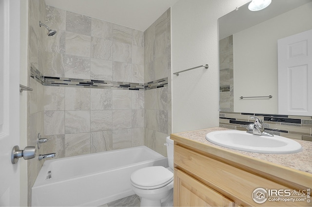 full bath with toilet, vanity, and bathtub / shower combination
