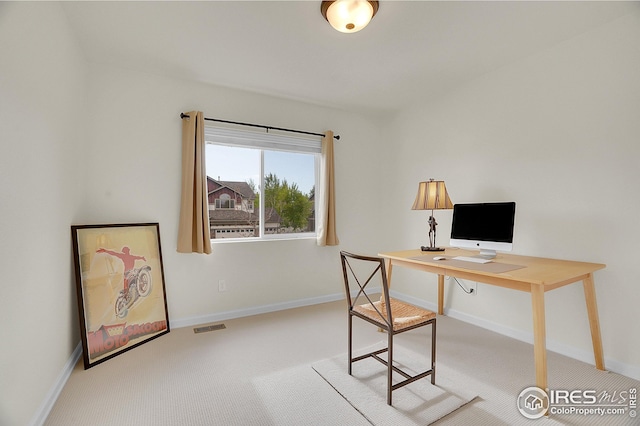 office space with carpet and baseboards
