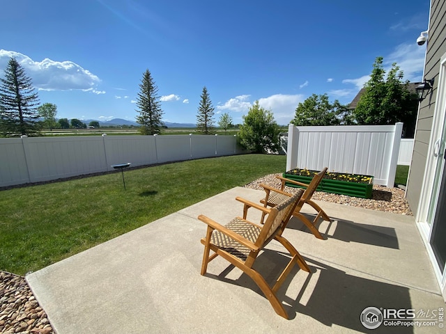 view of patio / terrace featuring a mountain view