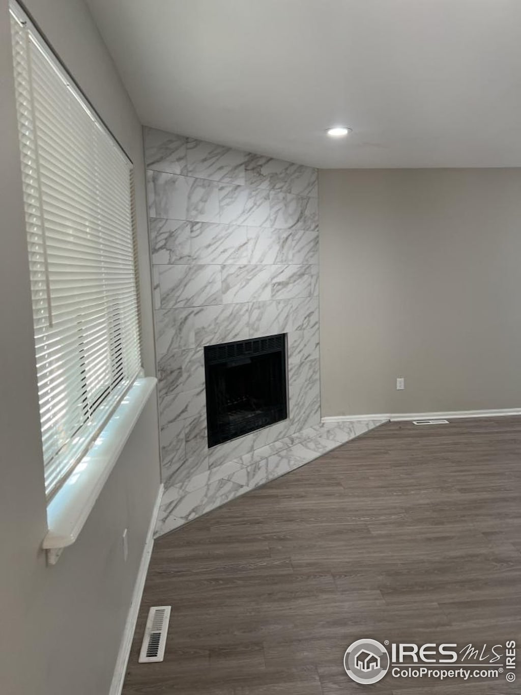 2005 Goss St, Boulder, CO 80302 - unfurnished living room with a fireplace, wood finished floors, baseboards, and recessed lighting