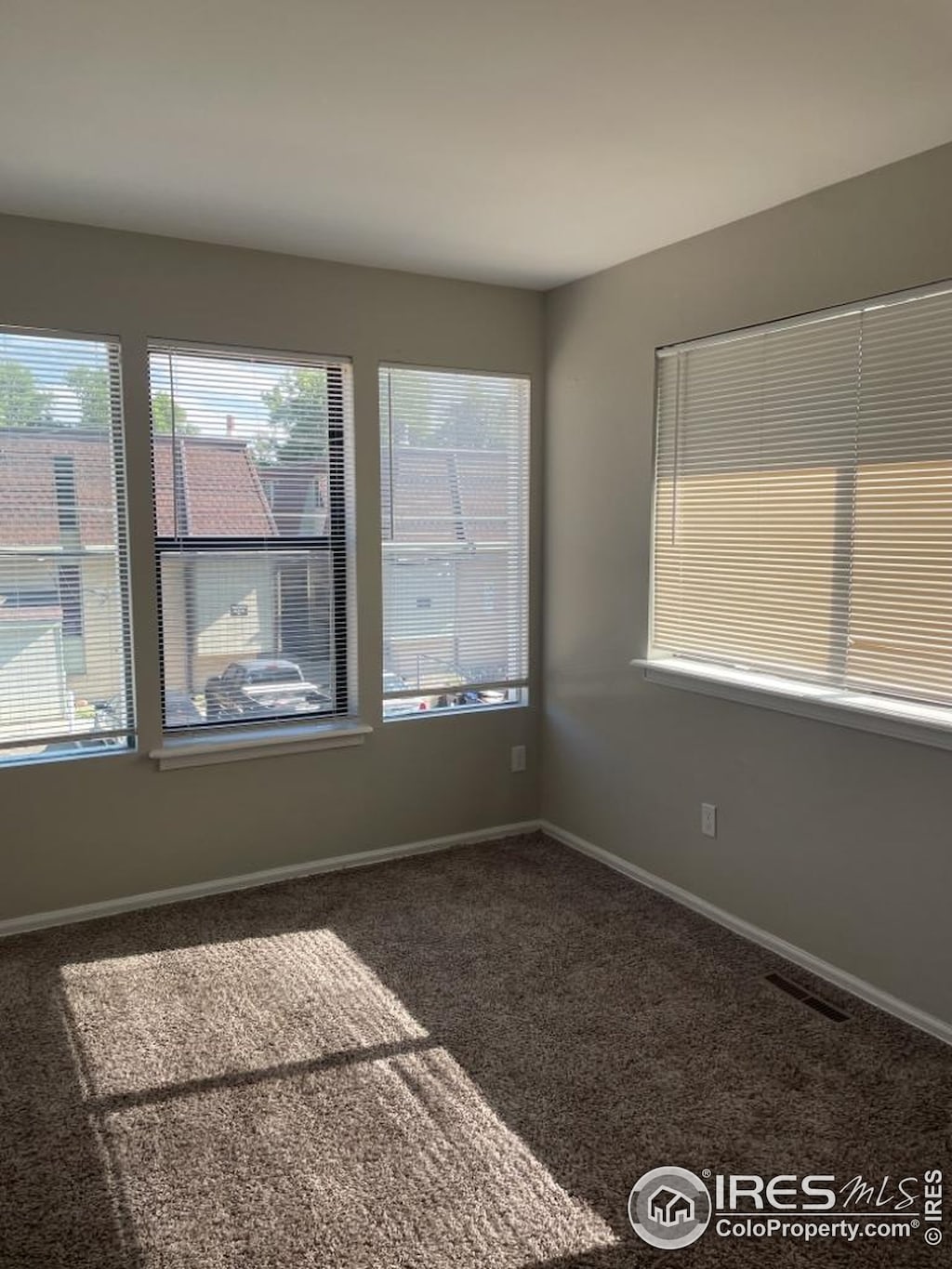 2005 Goss St, Boulder, CO 80302 - carpeted spare room featuring healthy amount of natural light and baseboards