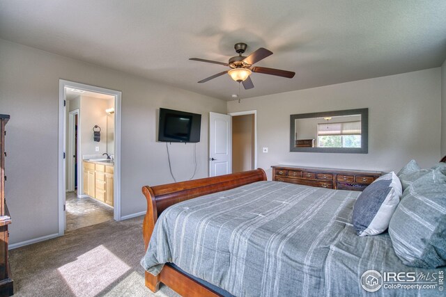 2069 Vineyard Ct, Windsor, CO 80550 - carpeted bedroom featuring baseboards, a ceiling fan, a sink, and connected bathroom