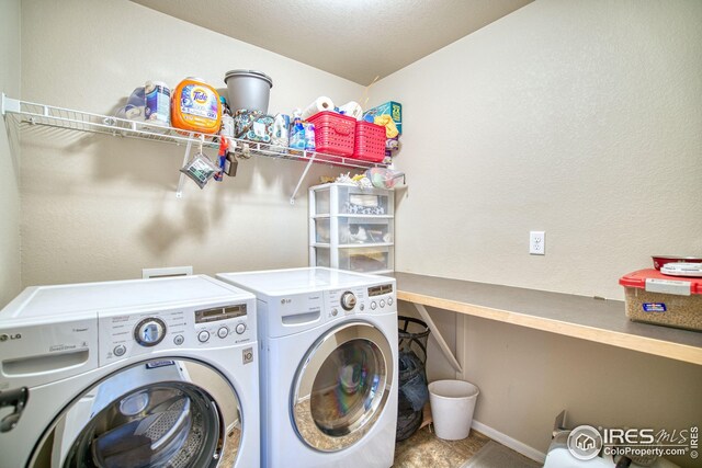 2069 Vineyard Ct, Windsor, CO 80550 - washroom with washing machine and clothes dryer and baseboards