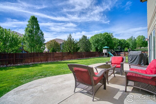 2069 Vineyard Ct, Windsor, CO 80550 - view of patio / terrace featuring a playground and an outdoor hangout area