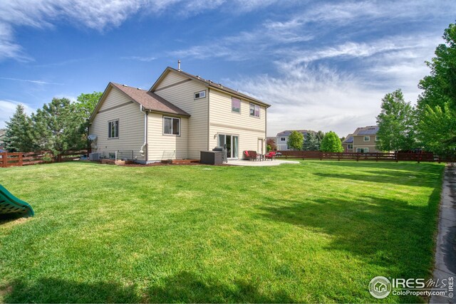 2069 Vineyard Ct, Windsor, CO 80550 - back of house with a patio and cooling unit
