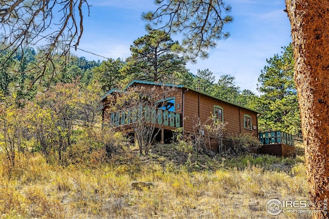 2450 Eagle Cliff Rd, Estes Park, CO 80517 - view of side of property with a wooden deck and a view of trees