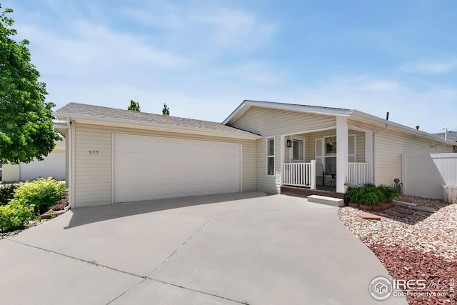 955 Sunchase Dr, Fort Collins, CO 80524 - view of front of home with a porch, driveway, and an attached garage