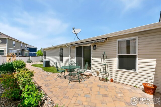 955 Sunchase Dr, Fort Collins, CO 80524 - view of patio featuring fence, cooling unit, and outdoor dining space