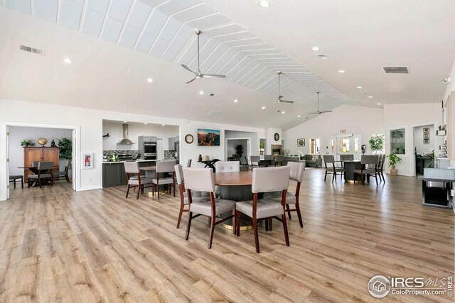 955 Sunchase Dr, Fort Collins, CO 80524 - dining space featuring high vaulted ceiling, ceiling fan, light wood finished floors, and recessed lighting