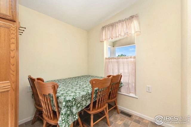 955 Sunchase Dr, Fort Collins, CO 80524 - dining space with baseboards and lofted ceiling