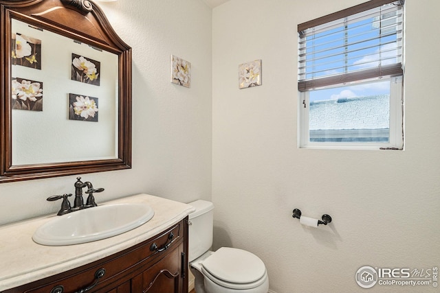 half bath with toilet and vanity