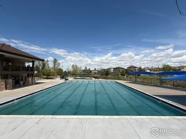 community pool with a patio