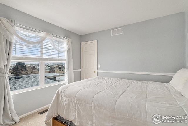 carpeted bedroom with baseboards