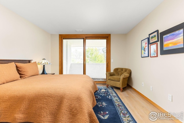 1140 Portland Pl Unit 207, Boulder, CO 80304 - bedroom featuring access to outside, light wood finished floors, and baseboards