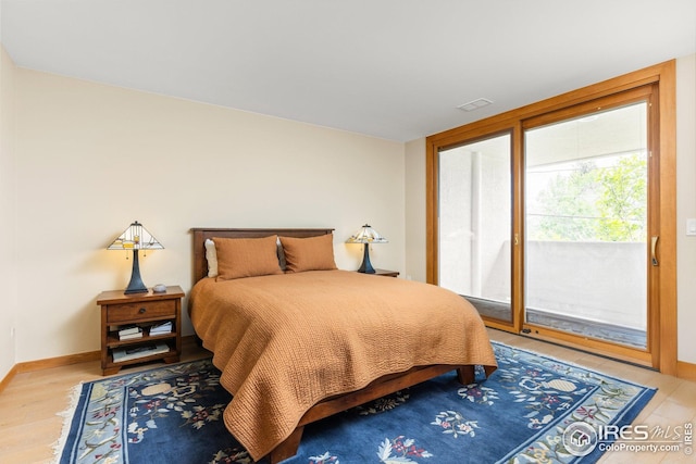1140 Portland Pl Unit 207, Boulder, CO 80304 - bedroom featuring access to outside, baseboards, and light wood-style flooring