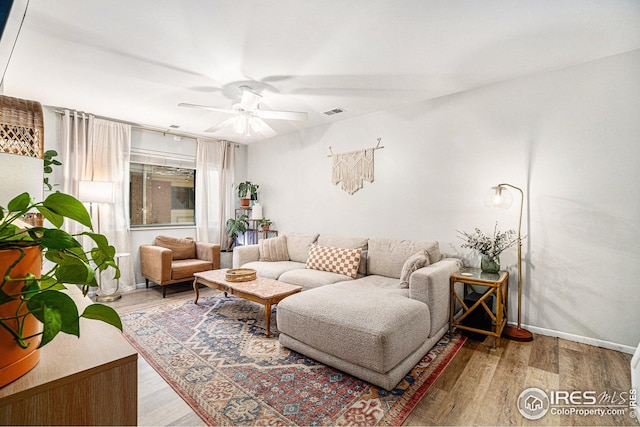 1001 Strachan Dr Unit 24, Fort Collins, CO 80525 - living room with ceiling fan, wood finished floors, and baseboards