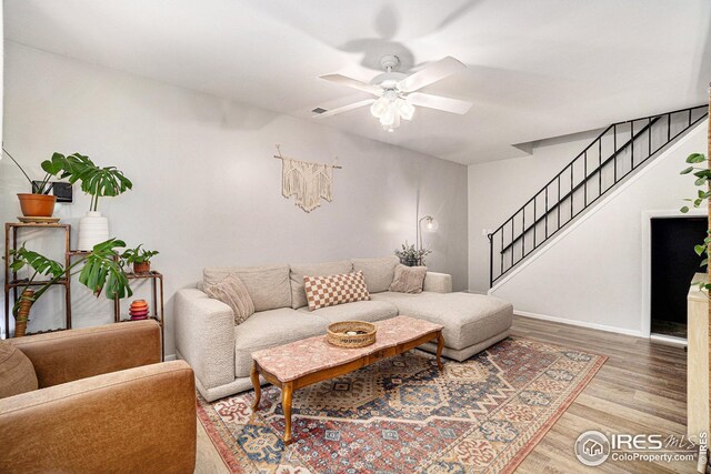 1001 Strachan Dr Unit 24, Fort Collins, CO 80525 - living room with a ceiling fan, light wood-type flooring, stairway, and baseboards