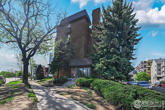 view of front of house featuring brick siding