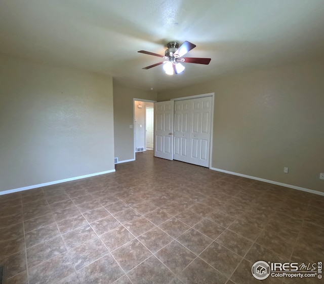22198 County Road 25, Fort Morgan, CO 80701 - unfurnished bedroom with a closet and ceiling fan