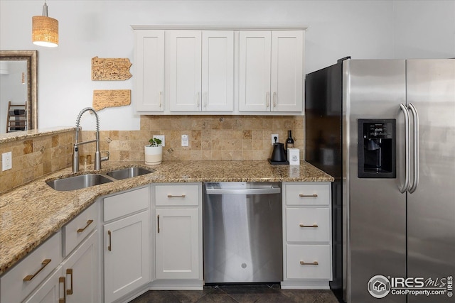 3039 W Denver Pl, Denver, CO 80211 - kitchen with stainless steel appliances, a sink, light stone counters, white cabinetry, and tasteful backsplash