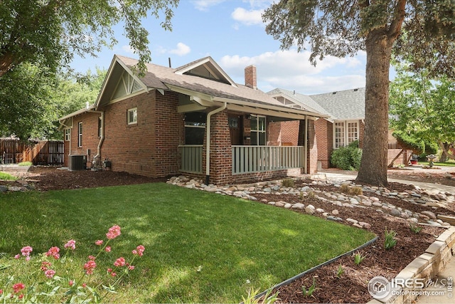 3039 W Denver Pl, Denver, CO 80211 - view of home's exterior with a chimney, a porch, brick siding, roof with shingles, and cooling unit