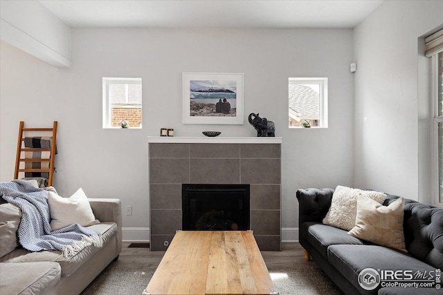 3039 W Denver Pl, Denver, CO 80211 - living room with wood finished floors, baseboards, and a tiled fireplace