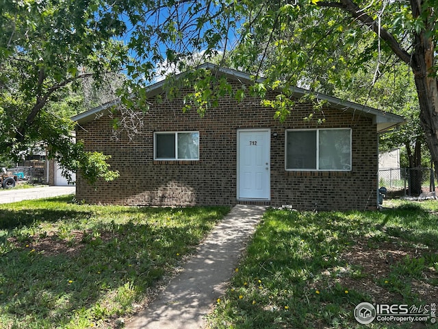 712 Meeker St, Longmont, CO 80504 - bungalow-style house with brick siding