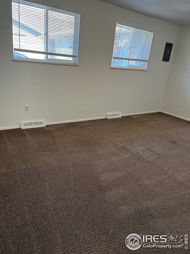 712 Meeker St, Longmont, CO 80504 - carpeted spare room featuring baseboards