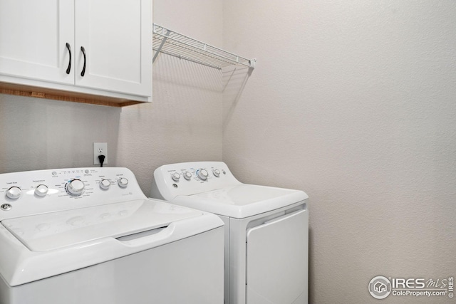 2497 Trio Falls Dr, Loveland, CO 80538 - laundry room with washing machine and clothes dryer and cabinet space