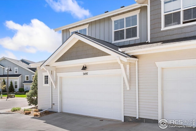 2497 Trio Falls Dr, Loveland, CO 80538 - garage featuring driveway