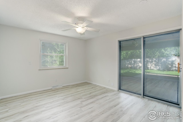 2620 Lloyd Cir, Boulder, CO 80304 - spare room with a ceiling fan, a textured ceiling, wood finished floors, and baseboards
