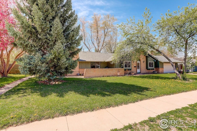 2620 Lloyd Cir, Boulder, CO 80304 - view of front facade with a front yard, brick siding, and board and batten siding