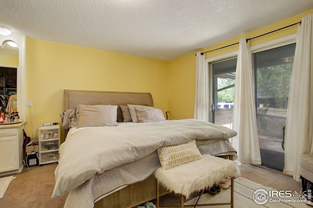 2620 Lloyd Cir, Boulder, CO 80304 - bedroom with light colored carpet, access to outside, and a textured ceiling