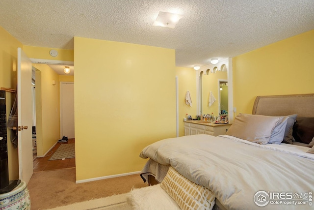 2620 Lloyd Cir, Boulder, CO 80304 - carpeted bedroom with a textured ceiling and baseboards