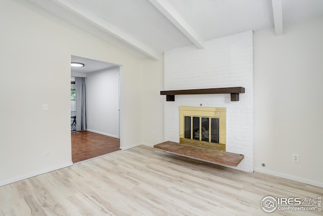 2620 Lloyd Cir, Boulder, CO 80304 - unfurnished living room featuring wood finished floors, a brick fireplace, and baseboards