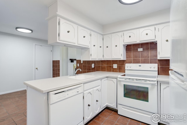 2620 Lloyd Cir, Boulder, CO 80304 - kitchen with white appliances, a sink, white cabinets, a peninsula, and backsplash